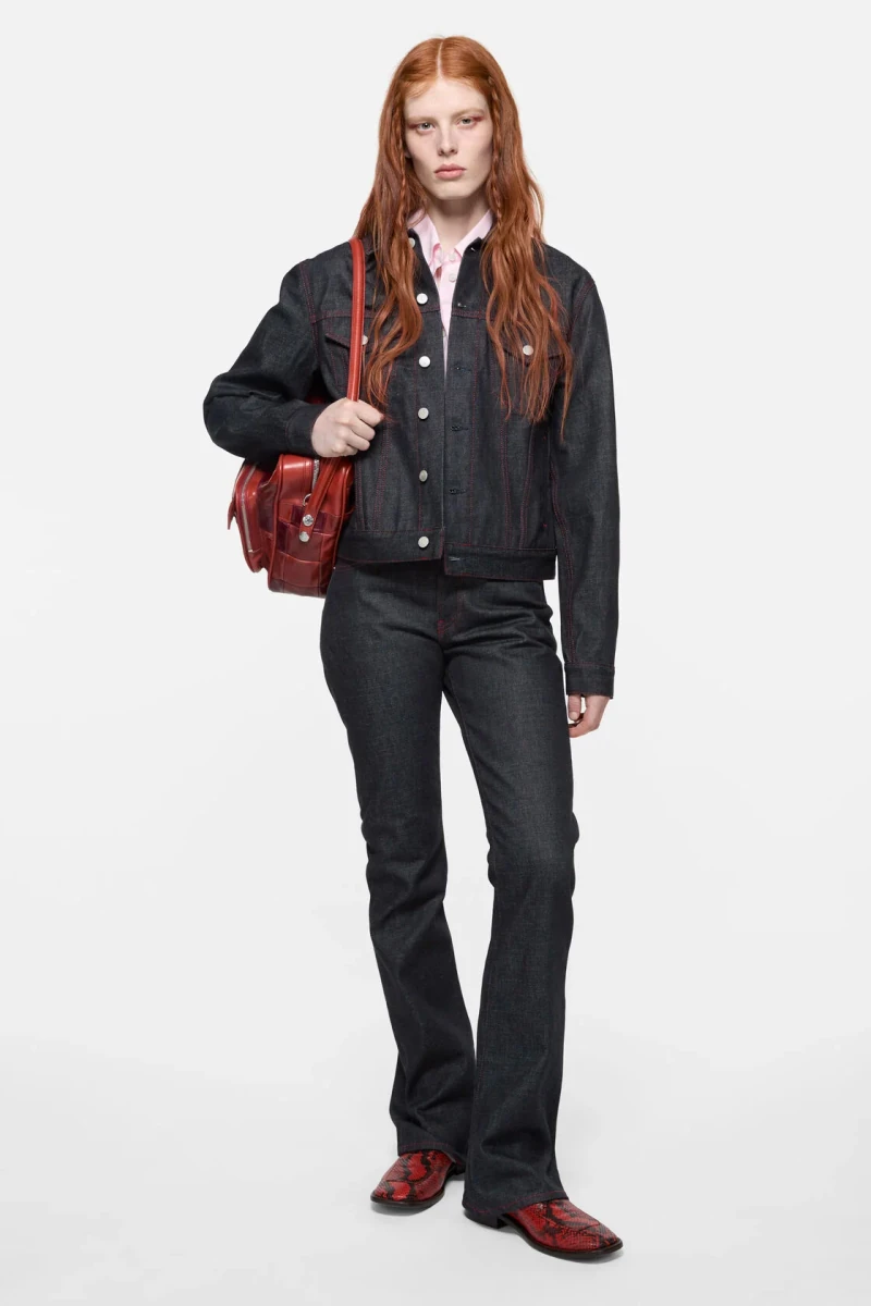 Blackish indigo Acne Studios 2009F raw jeans styled on a model in the official studio photograph