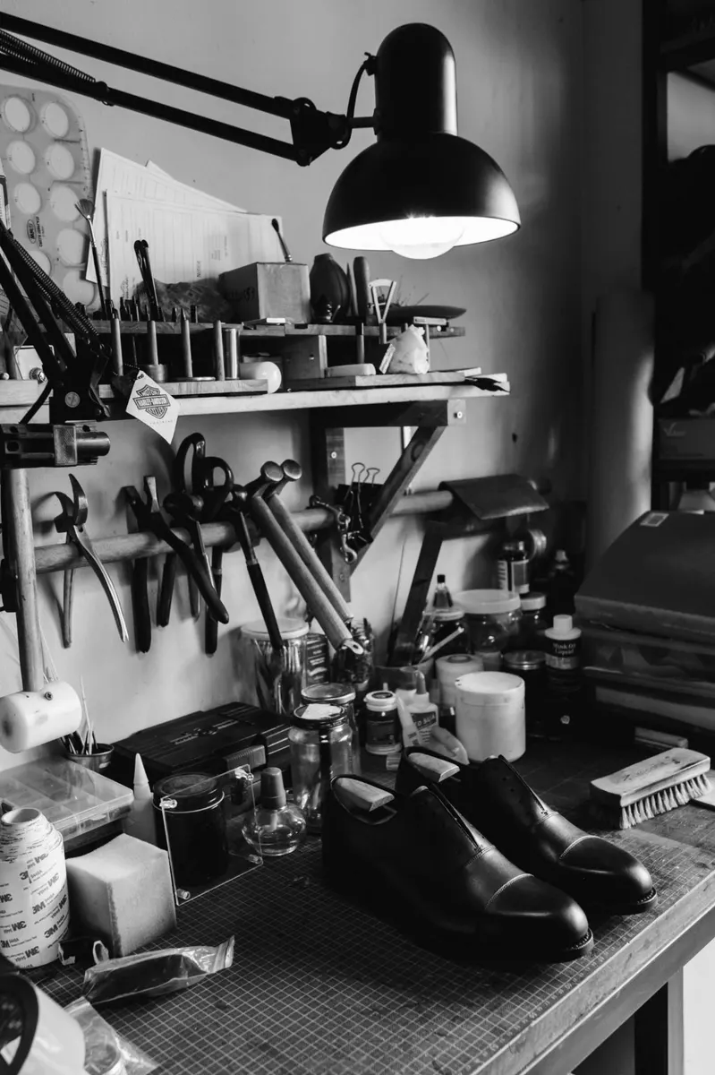 A cobbler's workshop where the goal is to make something last, not replace it