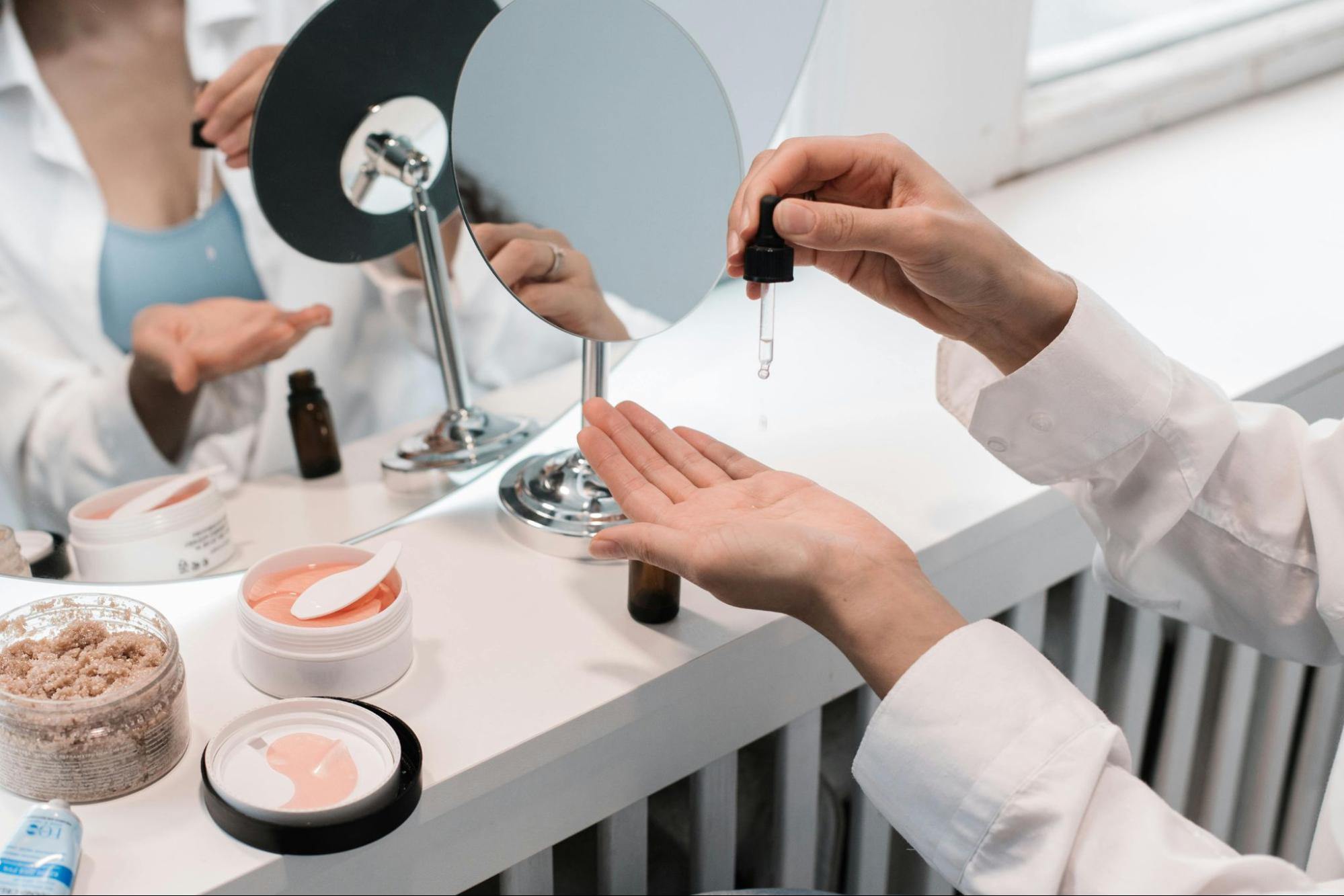 Person carefully applying a skincare serum representing informed consumer choices beyond cosmetic marketing claims