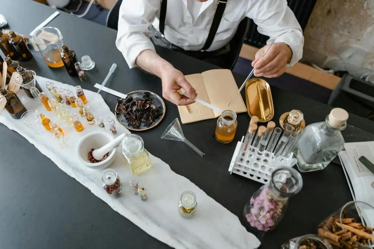 Cosmetic formulator working with botanical ingredients and vials representing the EU ingredient safety assessment process