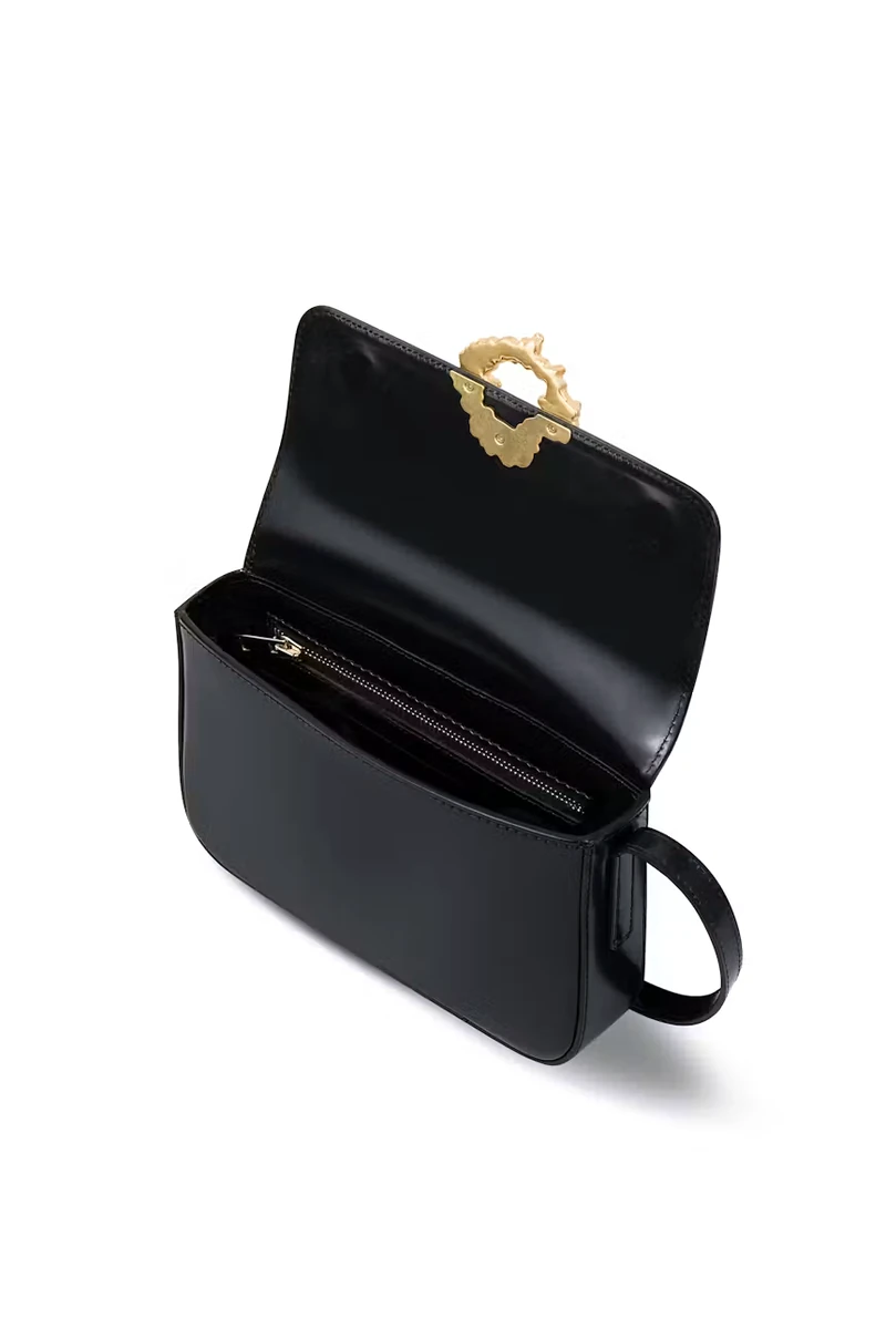 Black CHYLAK shoulder bag open to show decorative gold Sękacz buckle and interior