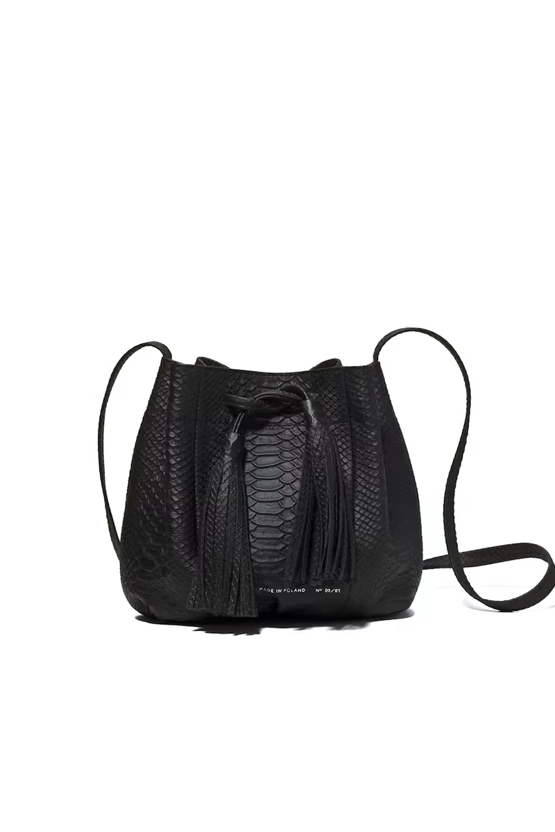 Black python-embossed CHYLAK small bucket bag with drawstring tassels