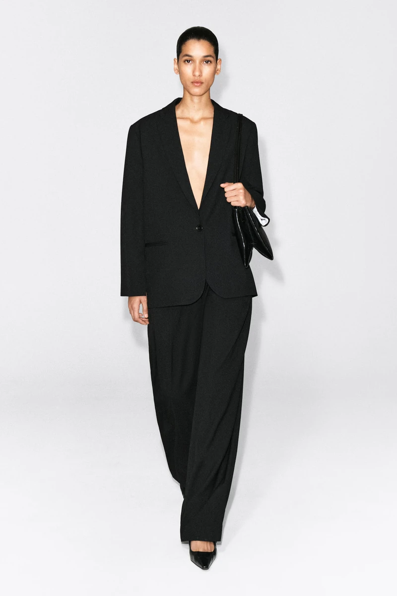 Black COS twill single-breasted blazer worn by a model