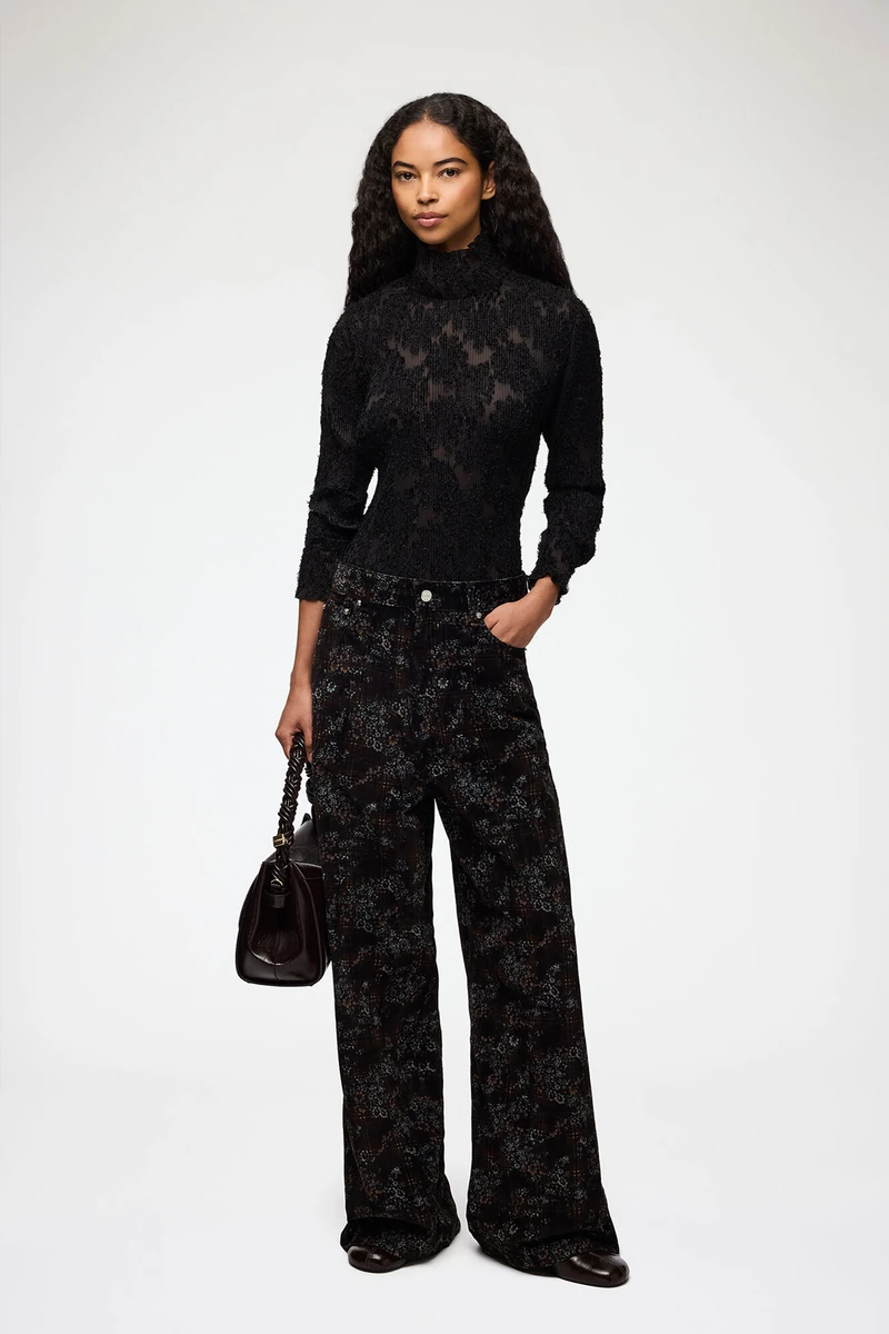 GANNI printed denim Marri jeans shown on a model in the official product photograph