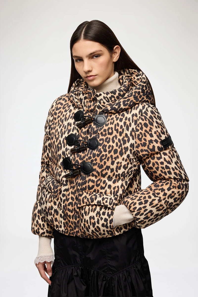 GANNI leopard-print mini puffer shown on a model in the official product photograph