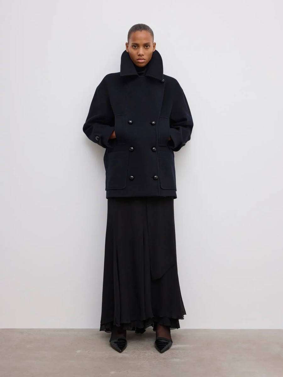 Navy blue House of Dagmar wool pea coat in the official studio photograph