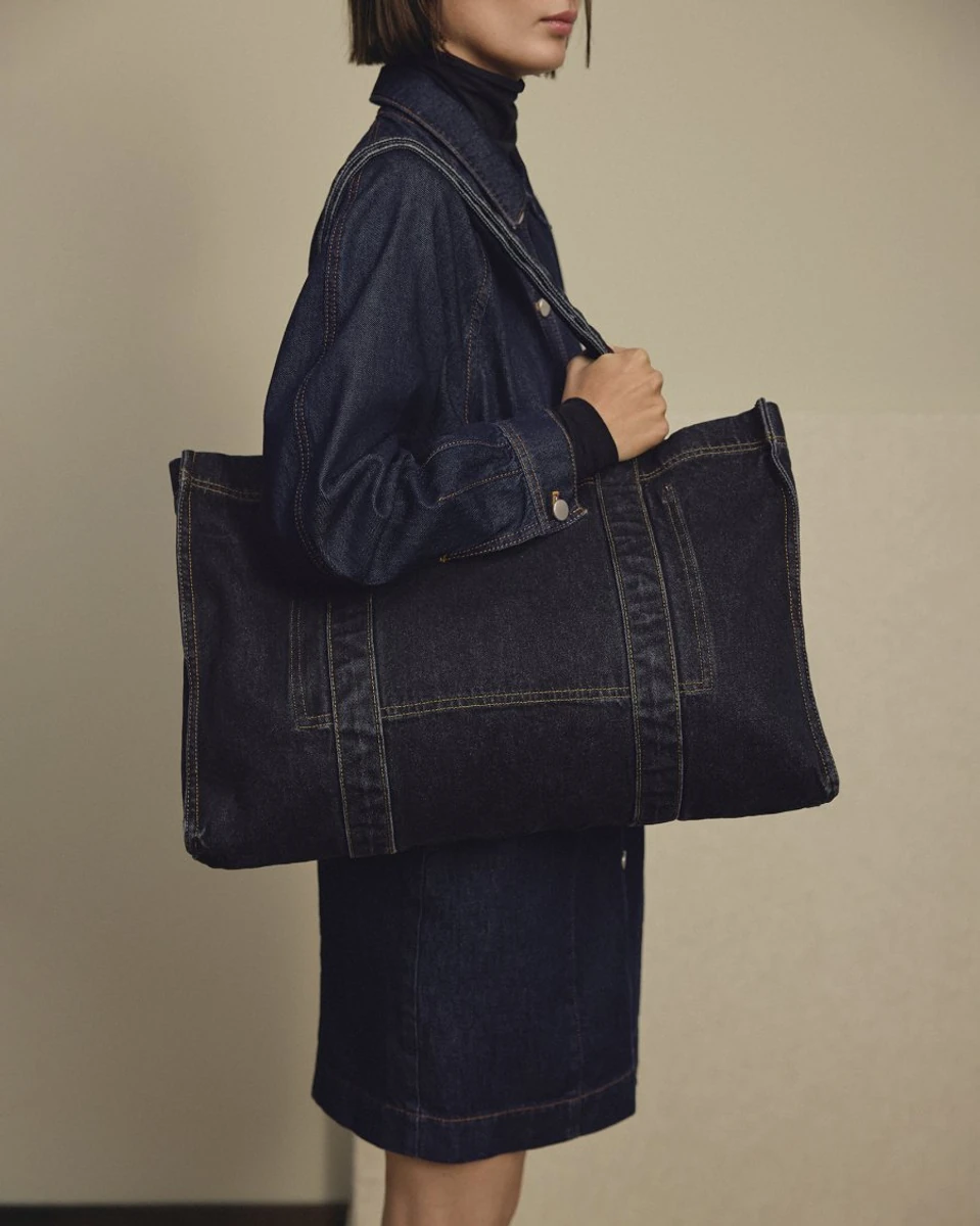 Dark denim MSCH Copenhagen KEYDylan shopper bag on a model, with original background