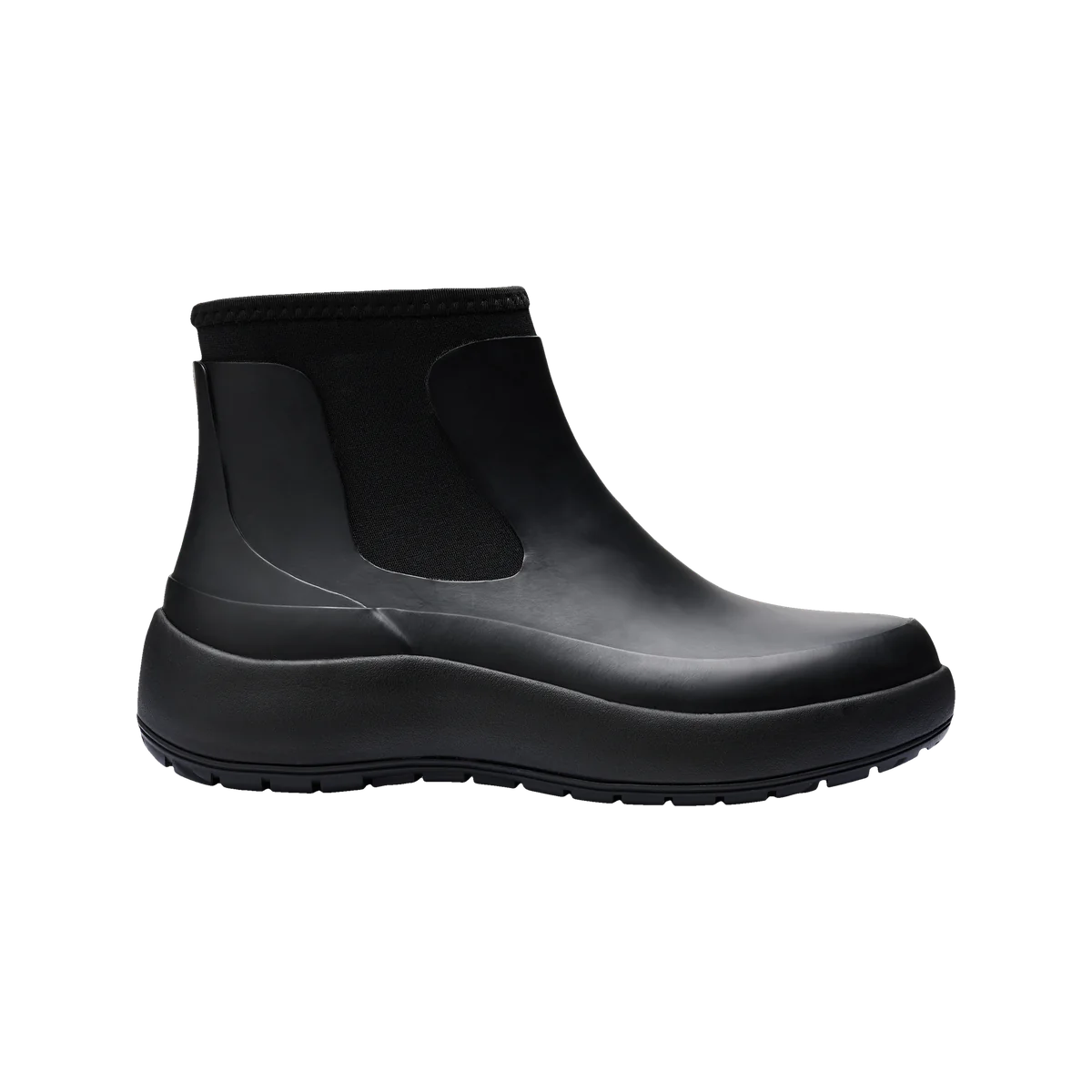 Rains The Dry Boot W in black, a women’s waterproof rubber ankle boot with neoprene instep and sculpted sole, shown in side profile